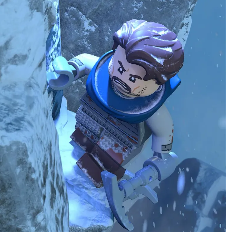 A split-screen shows young Bruce Wayne ascending a snowy cliffside. To the right, Batman looks upward against a moonlit background.
